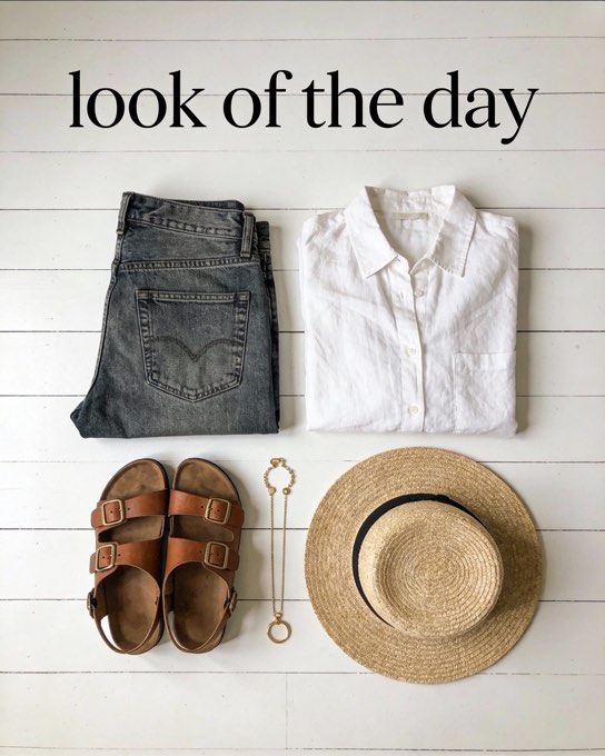 A minimalist and chic flat-lay of a curated outfit for a “look of the day” post.